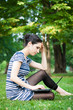 College student using her laptop outdoors at campus
