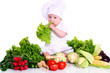 Cute baby chef with different vegetables