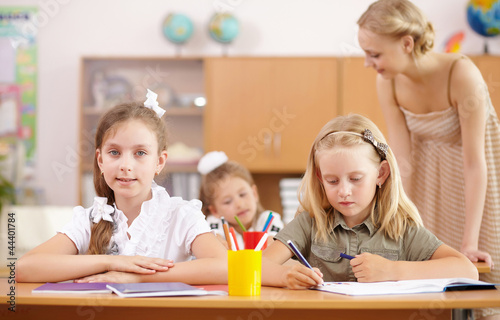 Photo: Little girl at school class Little girl at school class