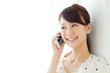 Beautiful young woman using a mobile phone. Portrait of asian.