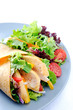 Chicken wrap on plate with side salad