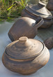 ceramics are for sale at an outdoor market