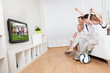Young family watching football