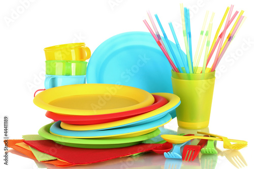 Photo: bright plastic disposable tableware isolated on white bright plastic disposable tableware isolated on white