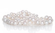 Photo: String of pearls on white background String of pearls on white background