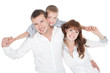 Foto: Smiling parents with little son posing on white Smiling parents with little son posing on white