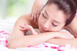 girl with attractive face having a massage for shoulder