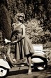 Photo: Woman in retro dress with a scooter Woman in retro dress with a scooter