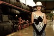 Woman in hat on a train station