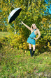 Photo: young woman posing near a tree young woman posing near a tree