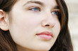 Hopeful young woman looking away
