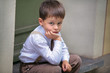 Portrait of a four years old boy outdoors in city