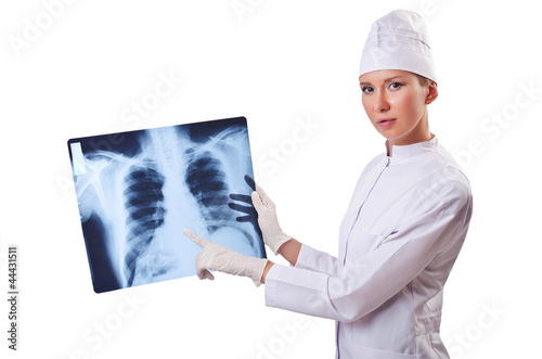 Photo: Woman doctor examining x-ray on white Woman doctor examining x-ray on white