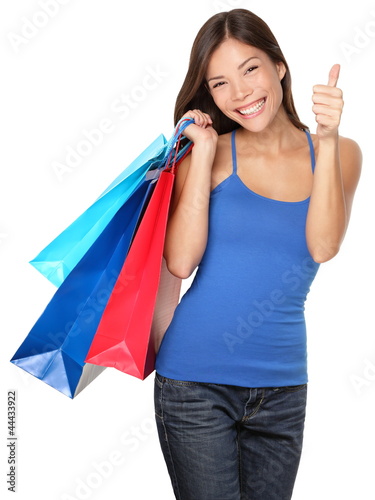Photo: Shopping woman thumbs up success Shopping woman thumbs up success