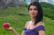 Photo: Glamorous woman holding a red apple Glamorous woman holding a red apple