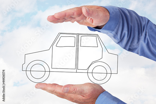 Photo: Hand holding car symbolically Hand holding car symbolically