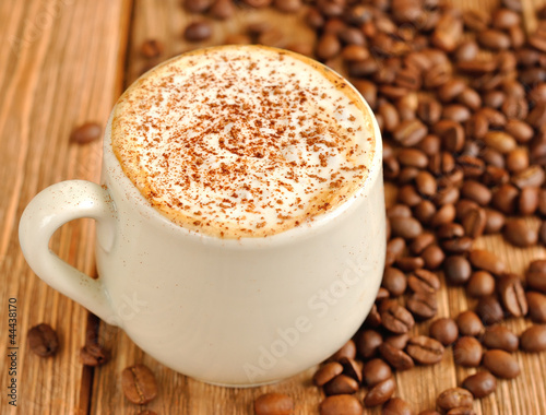 Photo: Coffee with froth and coffee beans Coffee with froth and coffee beans