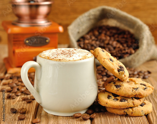 Photo: Coffee with foam and biscuits Coffee with foam and biscuits