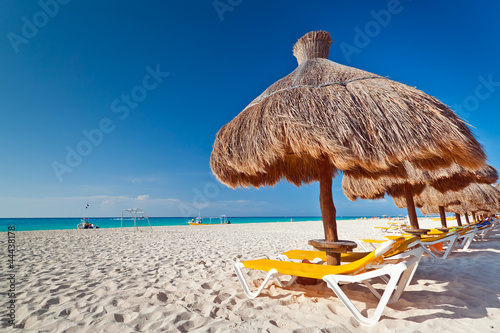 Photo: Holidays under parasol on Caribbean beach Holidays under parasol on Caribbean beach