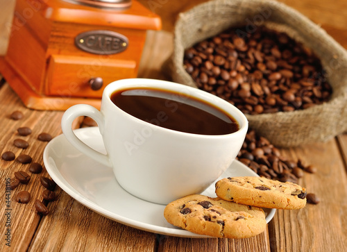 Photo: Coffee in a white cup and cookies Coffee in a white cup and cookies