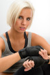 Kickbox woman put on protective gloves fitness