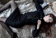 Beautiful seductive fashion young woman lying down