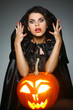 Sexual brunette in the suit of witch in night of Halloween
