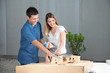 Couple Selecting Colors For Model House