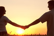 Young couple holding hands