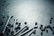 Foto: Wrenches, nuts and screws on a metal plate Wrenches, nuts and screws on a metal plate