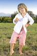 Foto: Young cute boy posing and eating a tasty ice cream Young cute boy posing and eating a tasty ice cream