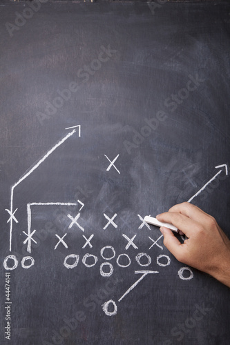 Photo: Football Coach Draws Play Football Coach Draws Play