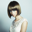 Photo: Portrait of beautiful sensual woman with elegant hairstyle Portrait of beautiful sensual woman with elegant hairstyle