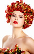Photo: Portrait of young beautiful woman with roses in hair, on white b Portrait of young beautiful woman with roses in hair, on white b