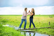 Two girls having fun while trying to push each other into the wa