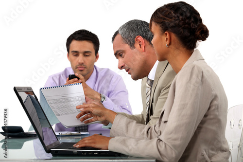 Photo: Three business people in meeting Three business people in meeting