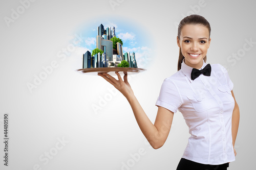 Photo: Waitress with a tray with green symbol on it Waitress with a tray with green symbol on it