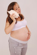 Photo: pregnant woman has put a seashell to your ear pregnant woman has put a seashell to your ear