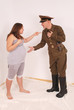Pregnant woman and a man in uniform