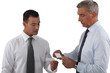 Executives exchanging business cards