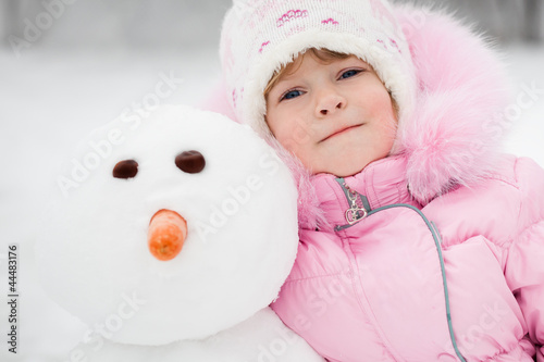 Photo: Child with snowman Child with snowman