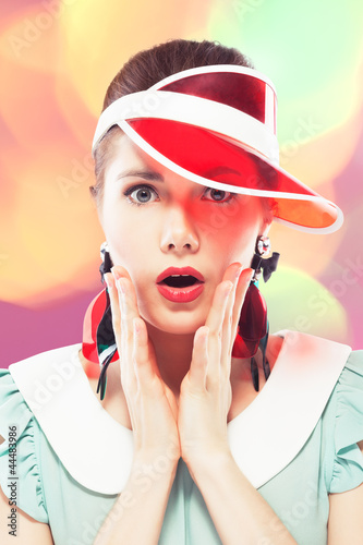 Photo: Surprised girl in red sun visor Surprised girl in red sun visor