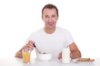 Photo: handsome man taking breakfast, isolated on white handsome man taking breakfast, isolated on white