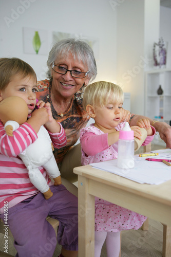 Photo: grandmother taking care of her grandchildren grandmother taking care of her grandchildren