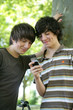 Teenagers playing with cellphone