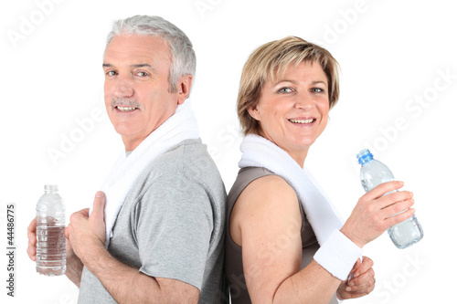 Photo: Mature couple drinking water Mature couple drinking water