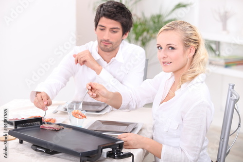 Photo: couple having dinner couple having dinner