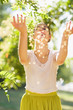Photo: Young woman throwing little leafs Young woman throwing little leafs