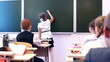 school girl giving answer – writing text back to school