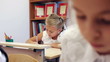 Schoolchildren writing task in the classroom